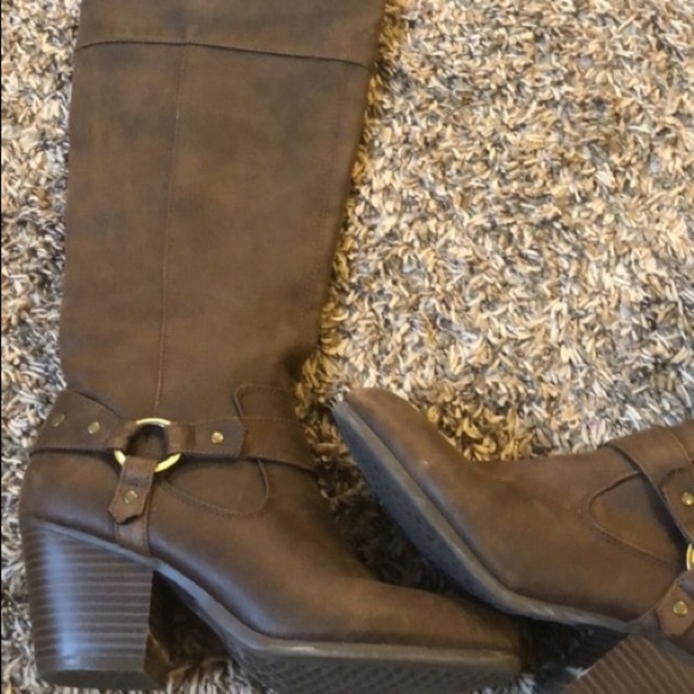 Tall dark brown boots with gold designs